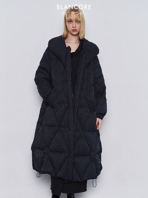 Volume quilted down jacket