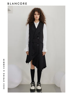 Asymmetrical pleated vest dress with open-back detail