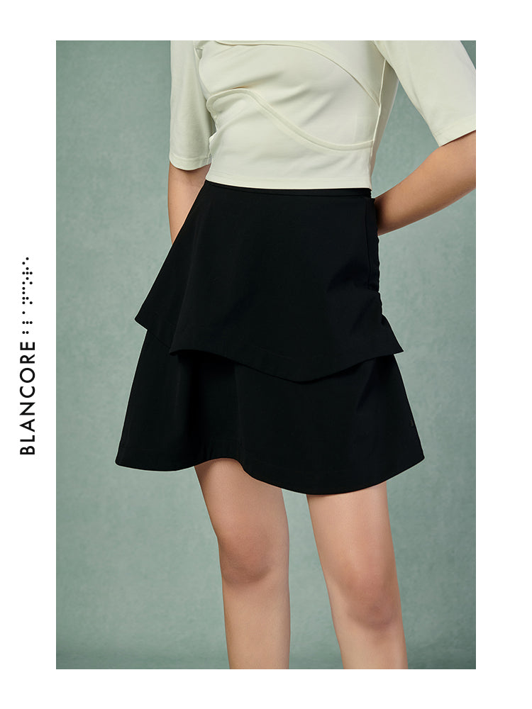 CURVED PLEATED SKIRT