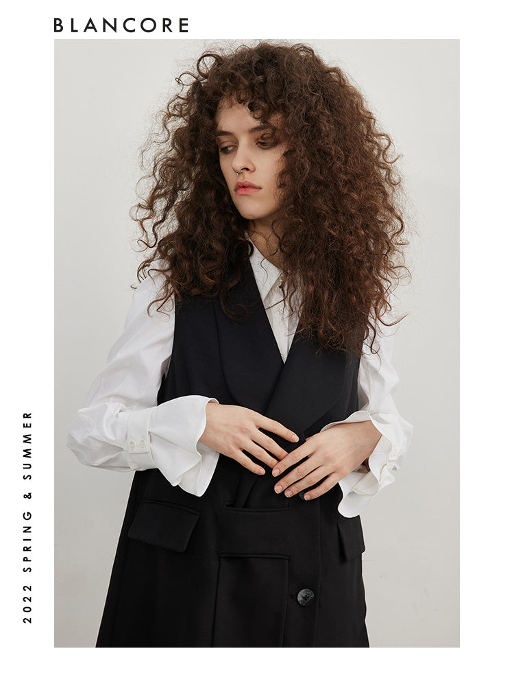 Asymmetrical pleated vest dress with open-back detail