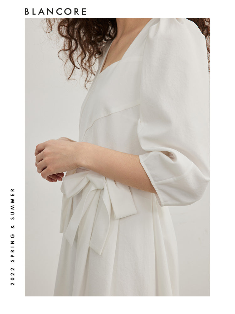 open-waist midi dress with large bow-embellished detail
