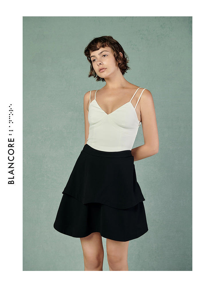 CURVED PLEATED SKIRT