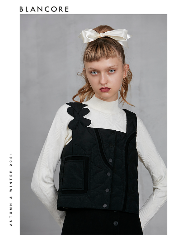 BOW BACK DOWN VEST WITH ASYMMETRIC SHOULDER DETAIL