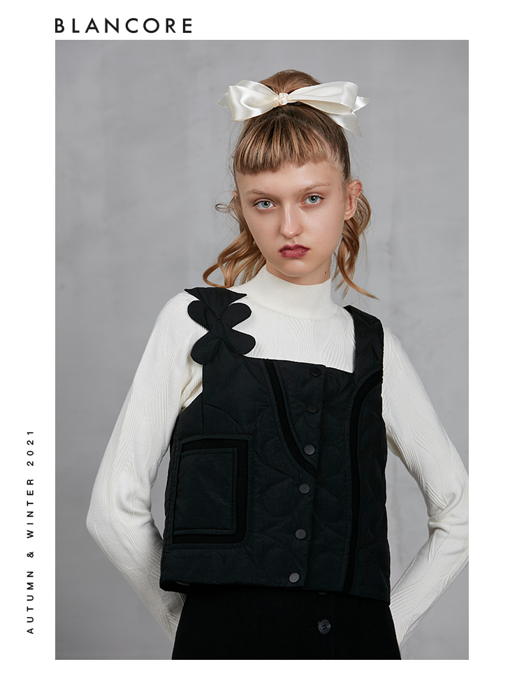 BOW BACK DOWN VEST WITH ASYMMETRIC SHOULDER DETAIL
