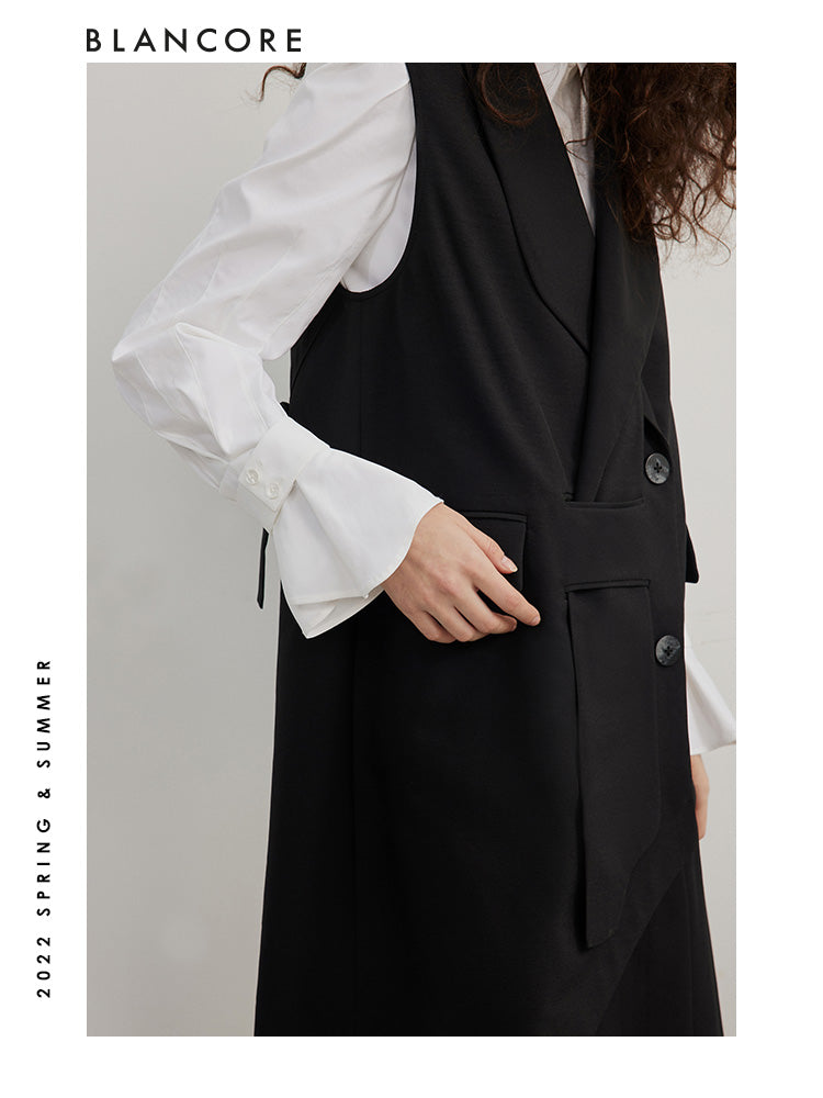Asymmetrical pleated vest dress with open-back detail