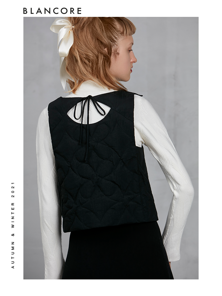 BOW BACK DOWN VEST WITH ASYMMETRIC SHOULDER DETAIL