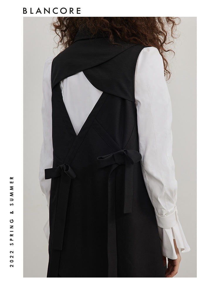 Asymmetrical pleated vest dress with open-back detail