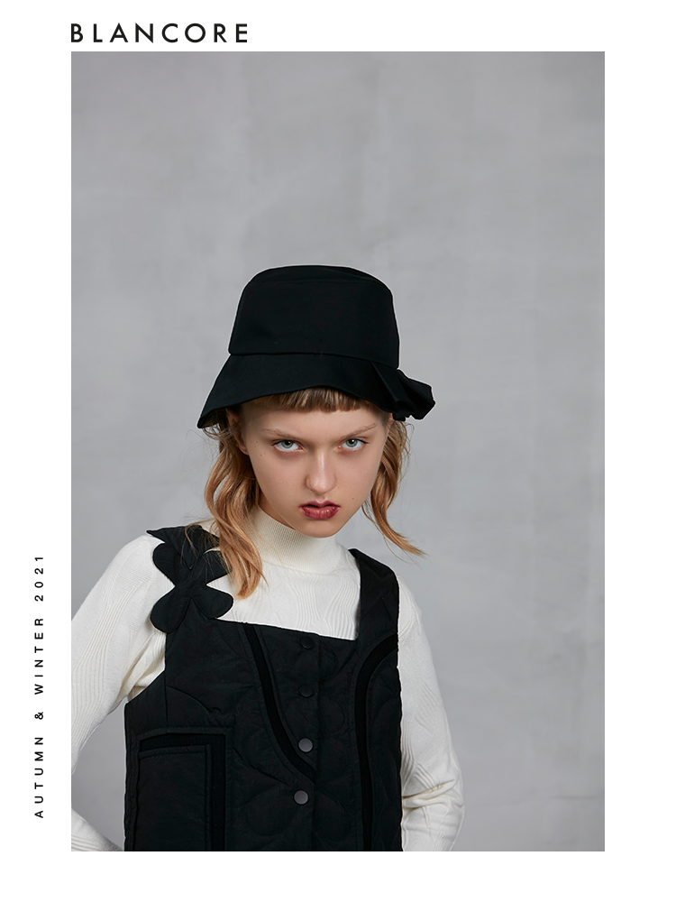 BOW BACK DOWN VEST WITH ASYMMETRIC SHOULDER DETAIL