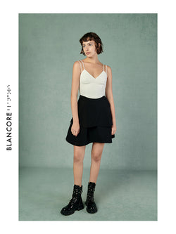 CURVED PLEATED SKIRT