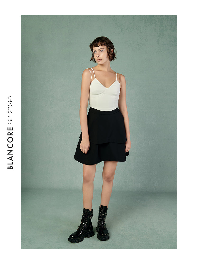 CURVED PLEATED SKIRT