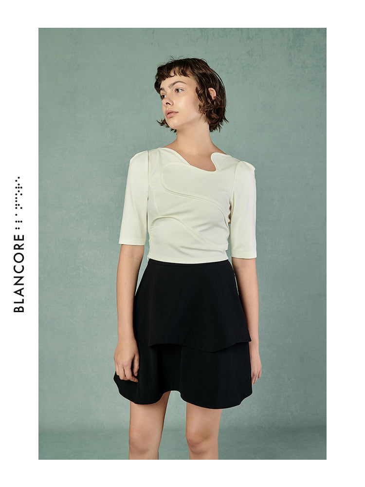 CURVED PLEATED SKIRT