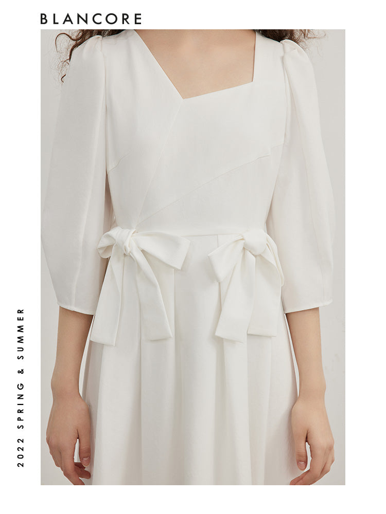 open-waist midi dress with large bow-embellished detail