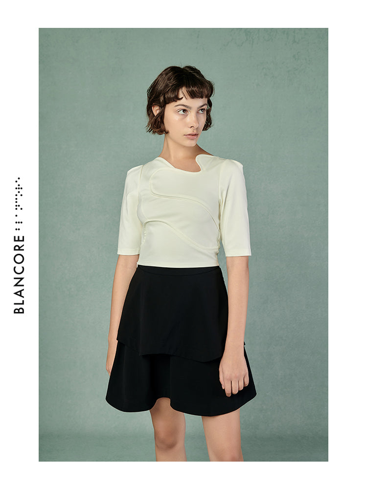 CURVED PLEATED SKIRT