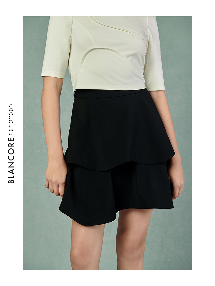 CURVED PLEATED SKIRT