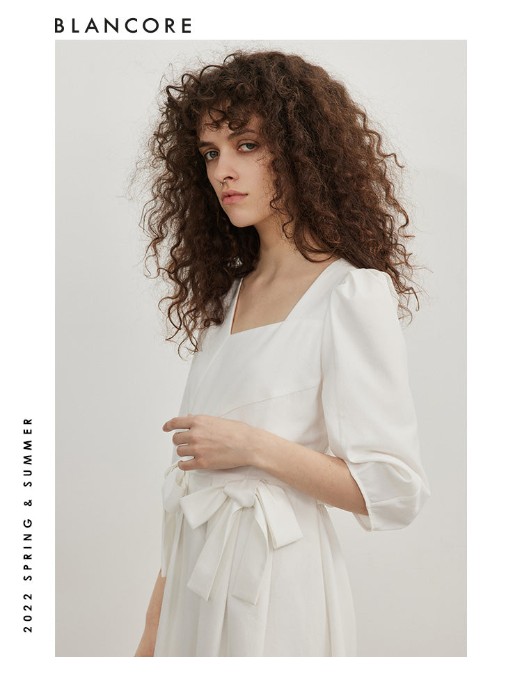 open-waist midi dress with large bow-embellished detail